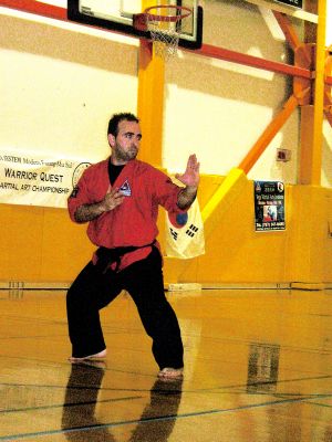Master Pinto in black belt forms