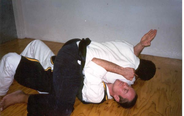 A03- Guiding his opponent into the low ride position, he slips his right hand past the left side of his opponents neck, at the same time, forces him to his right shoulder side